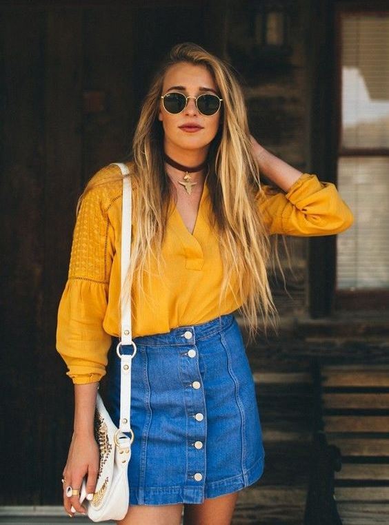 a relaxed look with a boho marigold blouse, a denim mini with buttons and a white bag