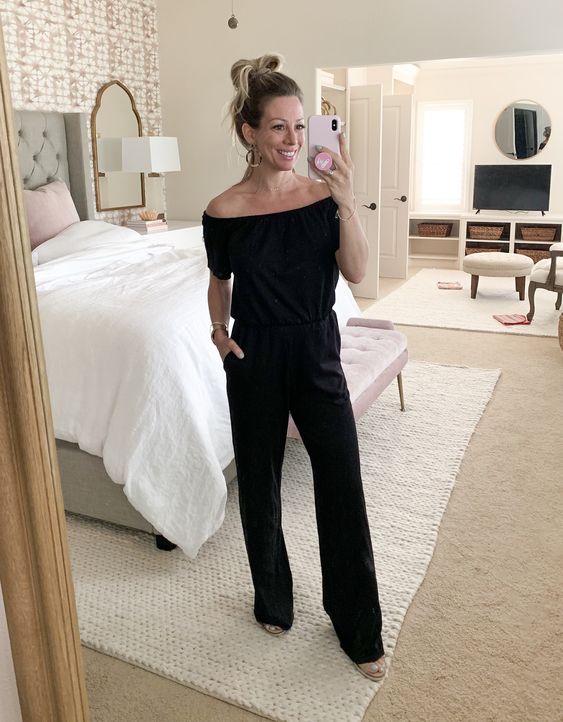 a monochromatic black look with an off the shoulder top, wideleg pants, nude shoes and an updo