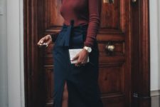 09 a brown turtleneck, a navy midi skirt with pockets, black trainers and a white snakeskin clutch