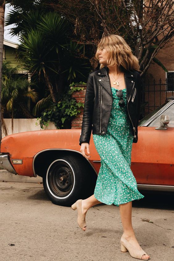 a vintage-inspired green botanical print midi dress, a black leather jacket and vintage nude shoes