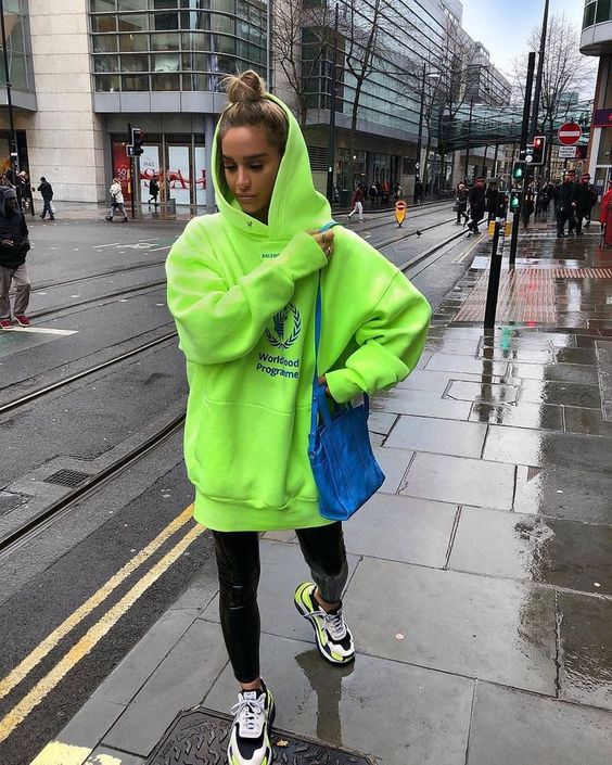 a stylish look in a neon hoodie