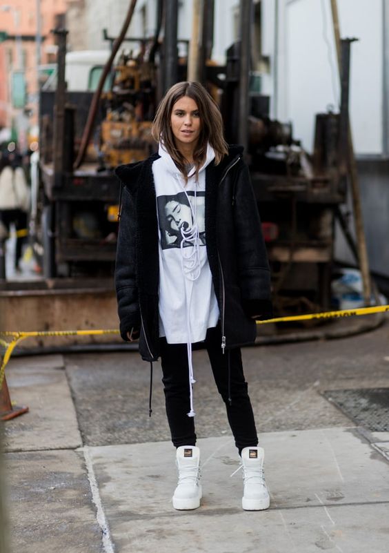 an oversized hoodie and a black shearling coat for a super cool and edgy look