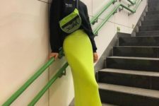 13 a trendy sporty look with a black sweatshirt, a neon yellow skirt, black and white trainers and a neon green bag