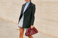 14 an edgy look with trendy boots and an oversized blazer is crowned with a burgundy soft clutch