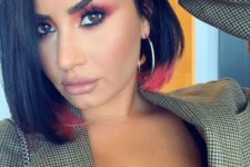 19 Demi Lovato rocking a black bob with hot pink dip dye ends – one of the trends of this year