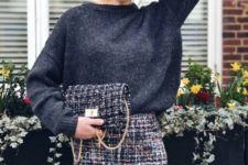 With gray loose sweater and tweed mini skirt