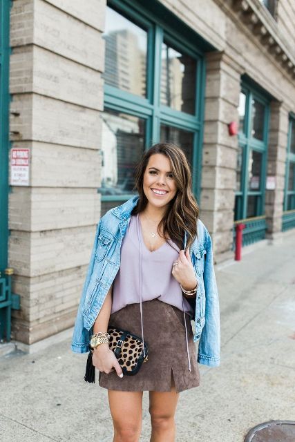 With lilac top, denim jacket and leopard clutch