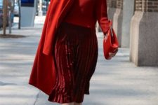 With red sweater, red coat, clutch and red suede ankle boots