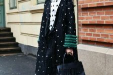 With white and black polka dot button down shirt, cropped jeans, black leather bag and black flat shoes