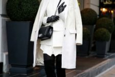 With white blazer, white coat, chain strap bag, white skirt and black over the knee boots