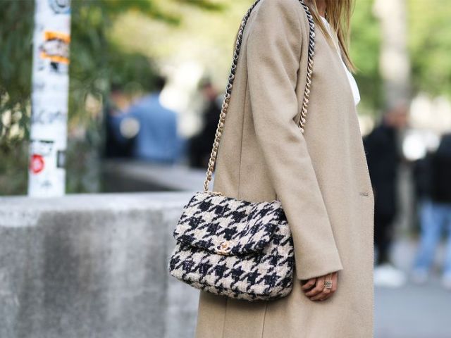 With white blouse, skirt and beige coat