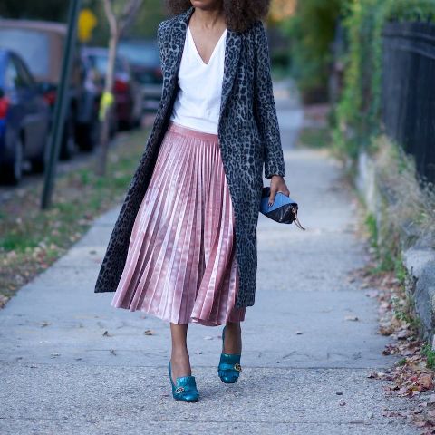 With white shirt, blue shoes, mini clutch and printed midi coat