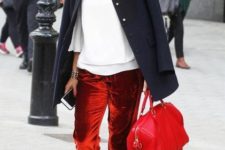 With white shirt, printed loafers, red bag and navy blue jacket
