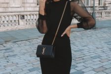 a black midi dress with sheer puffy sleeves, black shoes and a clutch for a formal party or a special occasion