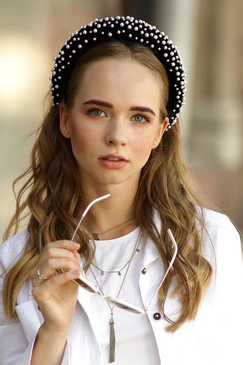 a black velvet headband with white pearls is a traditional and very refined accessory to add