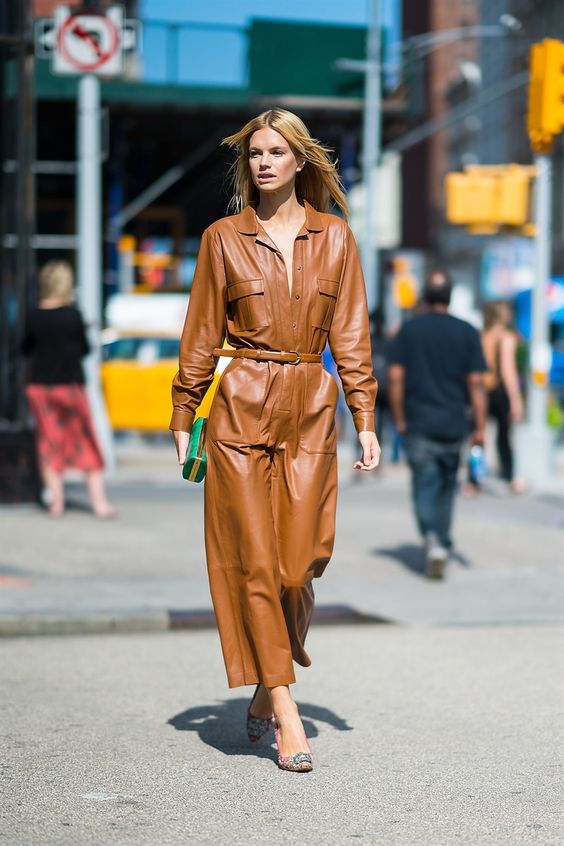 a brown leather maxi dress accented with a belt, colorful shoes and a bright green mini box clutch