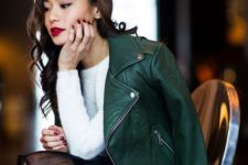 a dark green leather jacket is a bold and cool statement for a monochromatic outfit