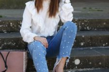 a girlish look with a white ruffle blouse, blue embellished jeans, blush shoes and a black bag