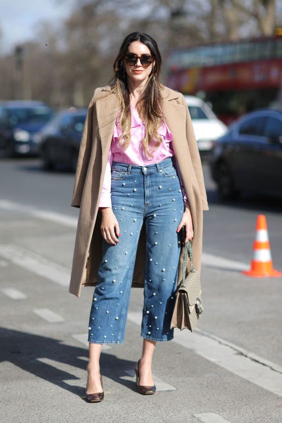 a pink ruffle blouse, pearl straight jeans, black shoes and a camel trench for the spring