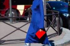 a shiny classic blue midi dress with lon sleeves, silver boots with pink heels and a matching clutch