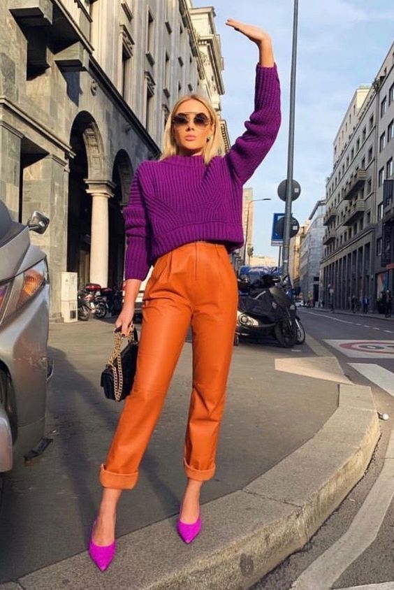 a super bold outfit with a fuchsia crop sweater and hot pink shoes plus orange leather pants