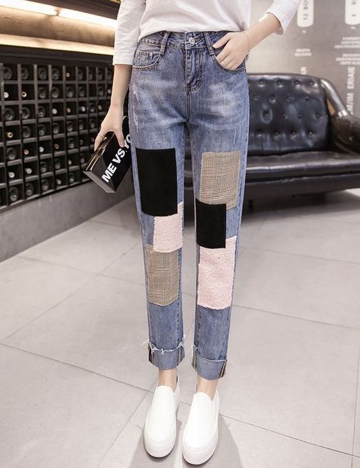 abstract applique jeans, a white long sleeve top and white slipons   such jeans require neutrals around