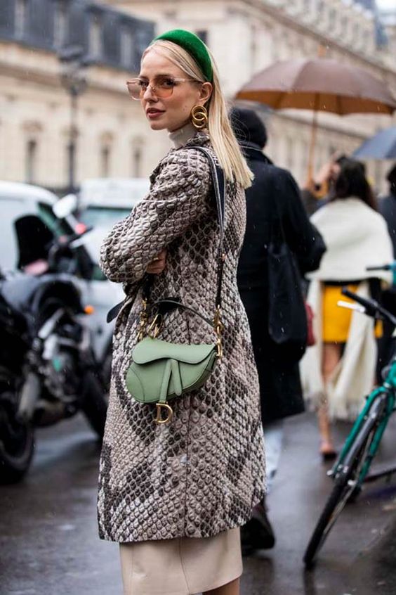 an emerald velvet padded headband and a grass-colored mini saddle bag for a fashion-forward person