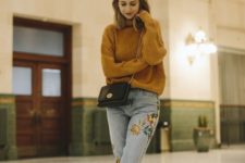 an oversized mustard sweater, whitewashed embroidered jeans, mustard slipper mules for the fall