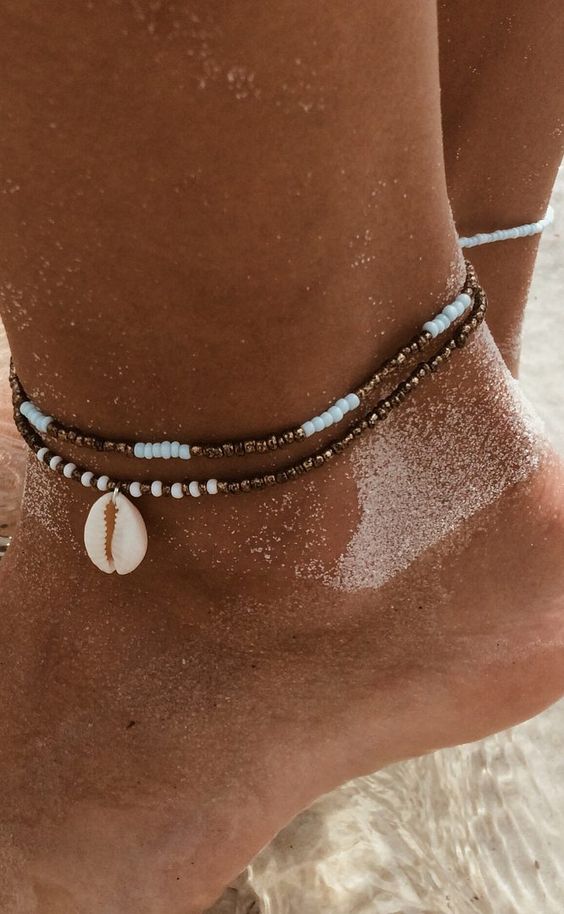 a copper and white bead anklet with a small shell - these shells are all the rage in jewelry now, and they ar ehot for anklets