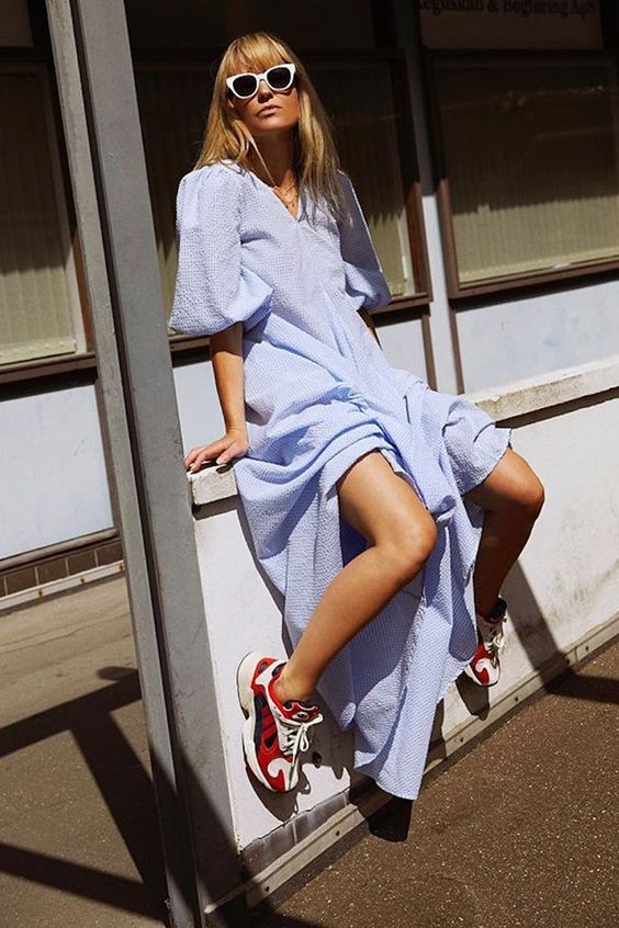 a blue maxi dress and colorful red trainers to make your summer look super hot and trendy