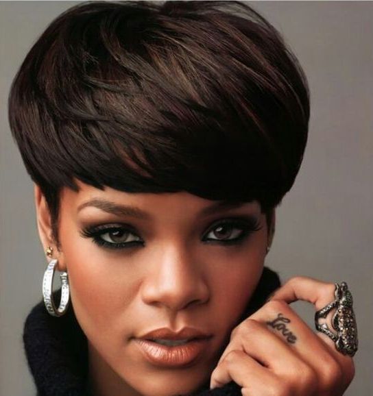 Rihanna wearing a dark bowl haircut looks wow and very bold and chic