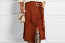 With beige sweater, beige bag and burnt orange wrapped midi skirt