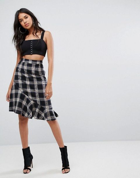 With black crop top and suede cutout boots