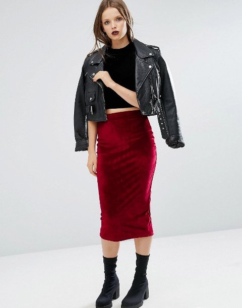With black cropped top, black leather jacket and black mid calf boots