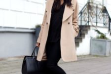 With black hat, black pants, tote bag and sweater