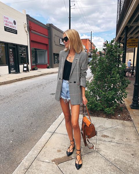 With black top, checked blazer, brown bag and lace up flats