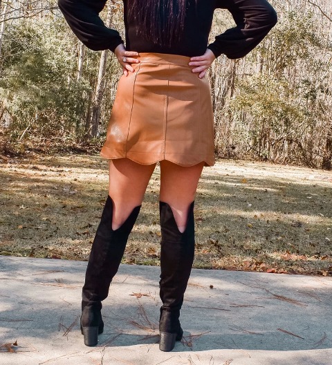 With blouse and high boots