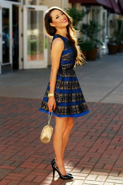 With golden mini bag and black patent leather pumps