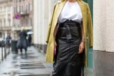 With loose blouse, coat and black high heeled boots