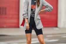 With printed t-shirt, gray blazer, black high heels and red bag