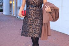 With red clutch, black tights, beige platform shoes and coat