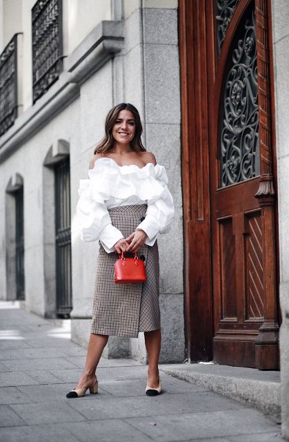 With white ruffled blouse, two colored shoes and red mini bag