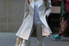 With white shirt, beige coat, cuffed pants and white bag