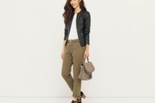 With white t-shirt, leather backpack, olive geen pants and heels