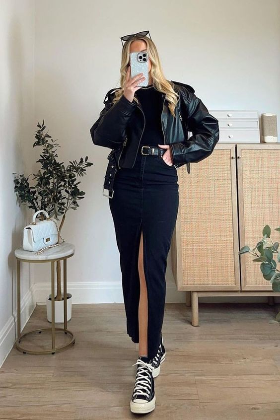 a black srping look with a tee, a denim maxi, high top sneakers, a leather cropped jacket, a black belt