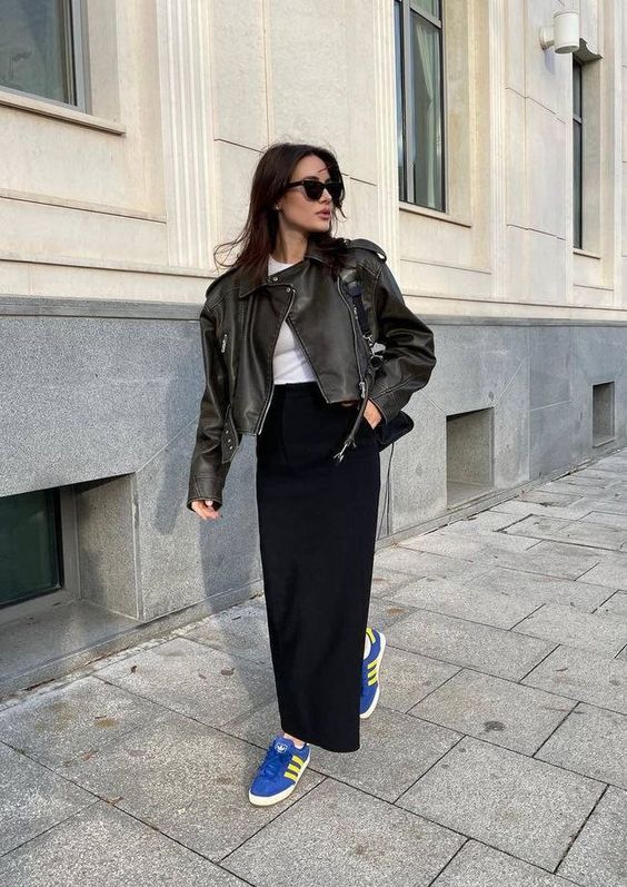 A classy spring look with a white t shirt, a black denim jacket, a black maxi skirt, electric blue sneakers and a black bag