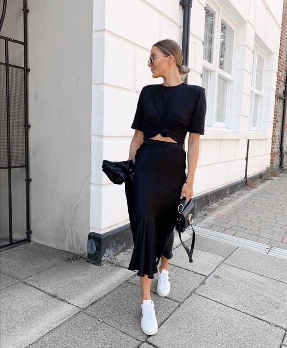 a comfy spring look with a black knotted t-shirt, a slip midi skirt, white sneakers, a black bag is cool