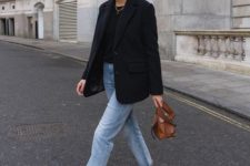a navy oversized blaer, a black tee, light blue jeans, brown square toe booties and a brown bag