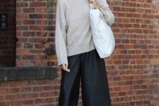 a neutral turtleneck, black leather bermuda shorts, black square toe heels and a white bag