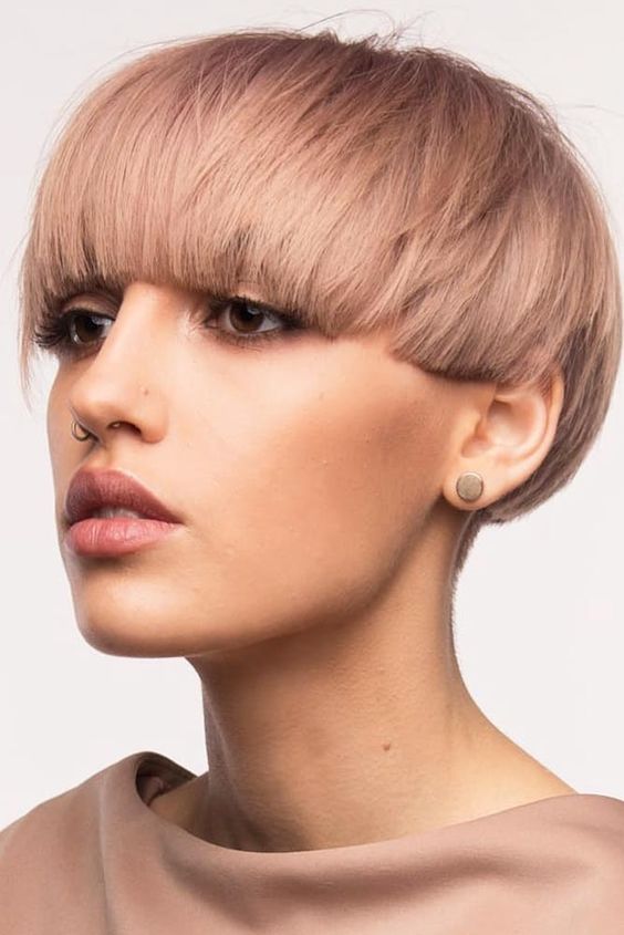 a trendy bowl cut done in a soft pastel pink shade will make your look ultimately trendy